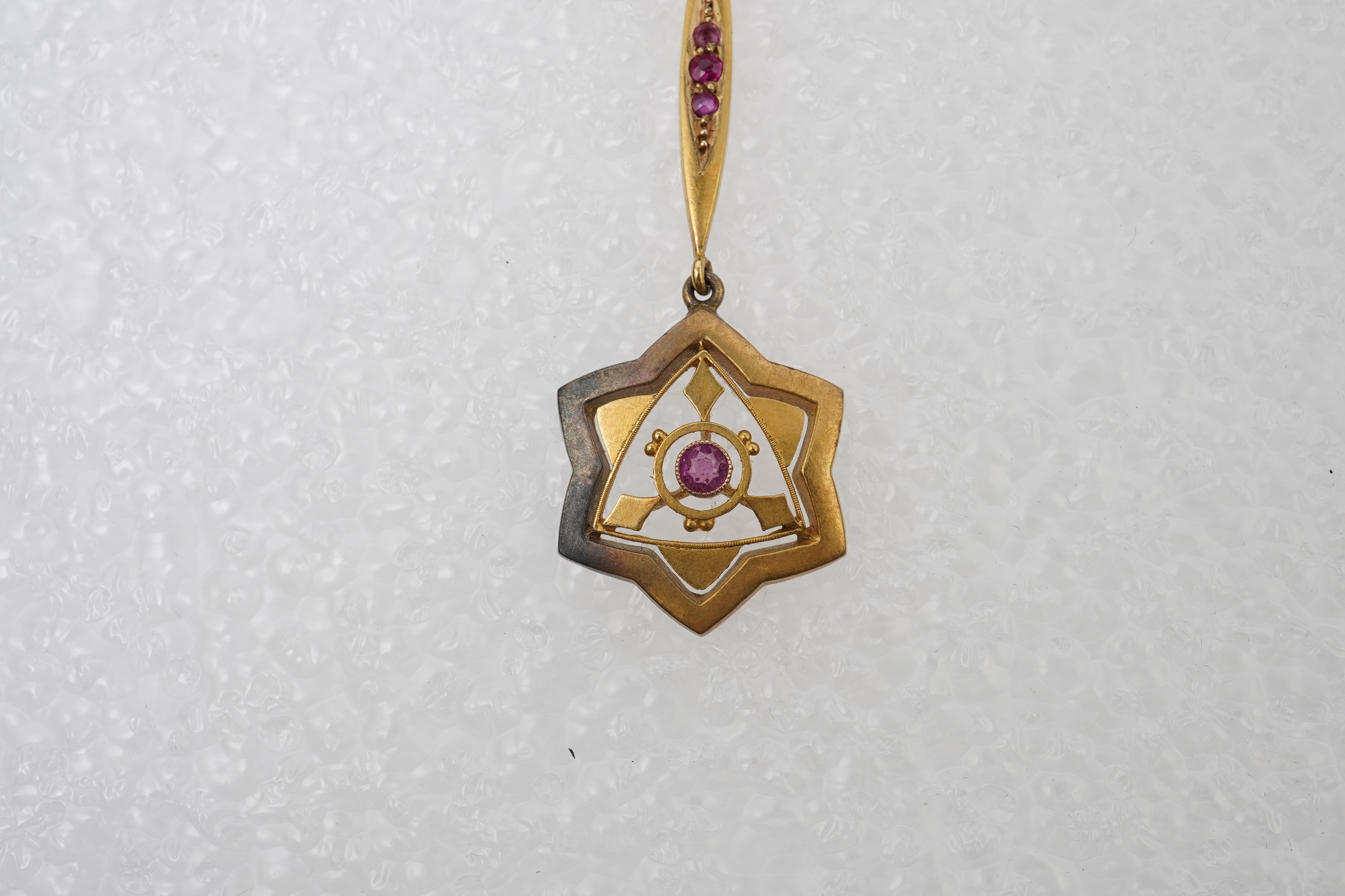 A gold, ruby and seed pearl pendant necklace, early 20th century